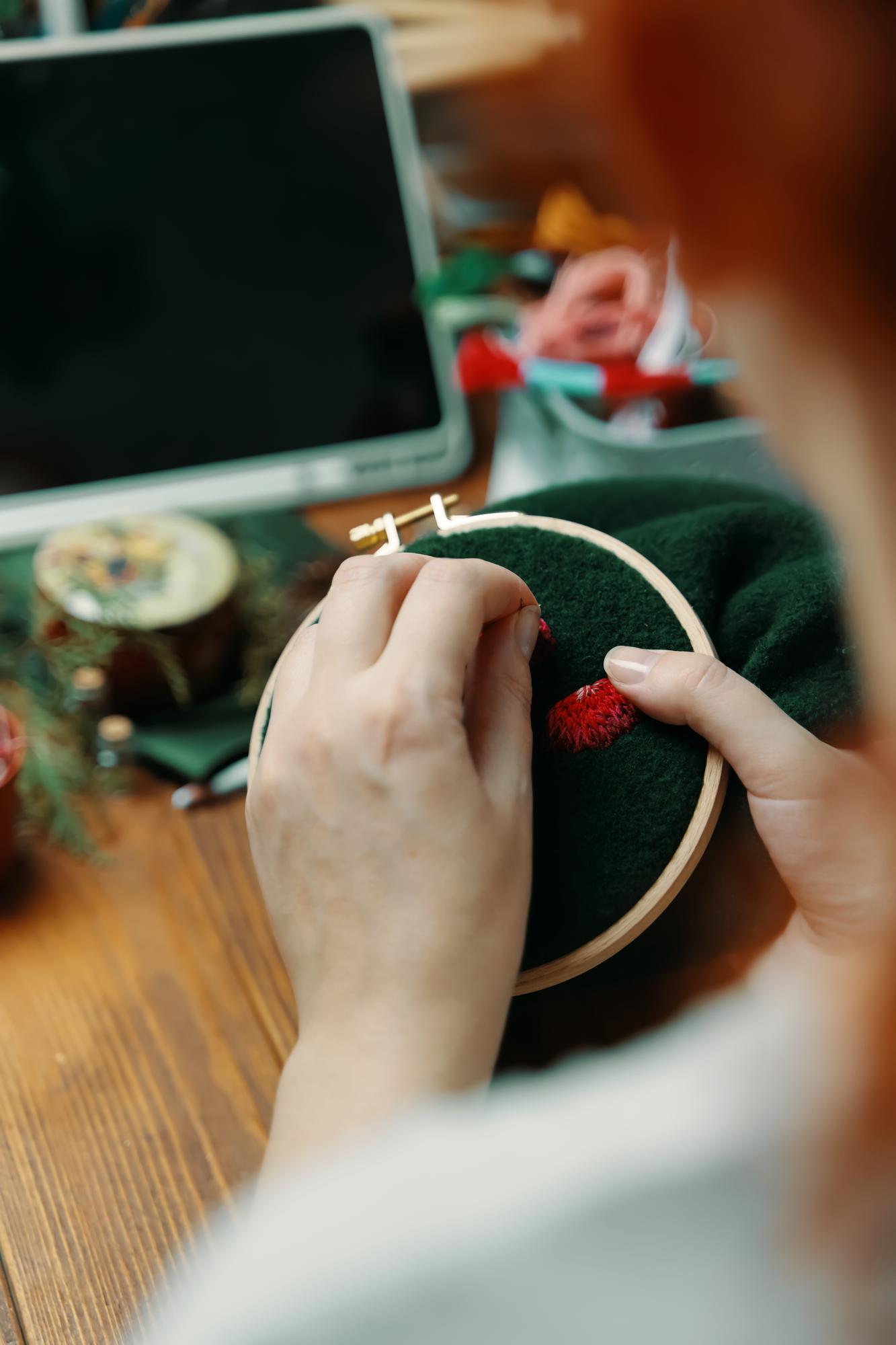 student stitching modern embroidery